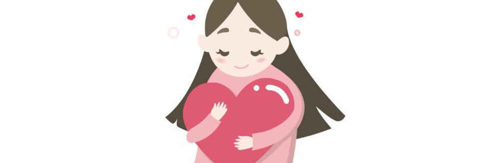 A young child hugging a three-dimensional heart shape