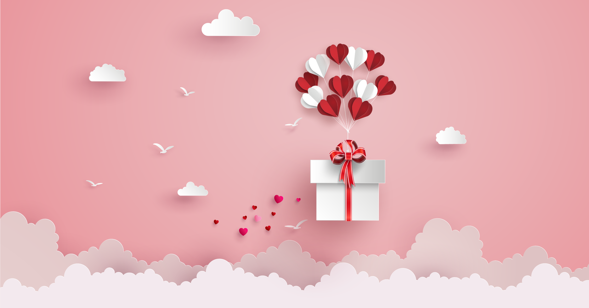 A gift box with a bouquet of balloons tied to it floats in a pink sky above fluffy white clouds